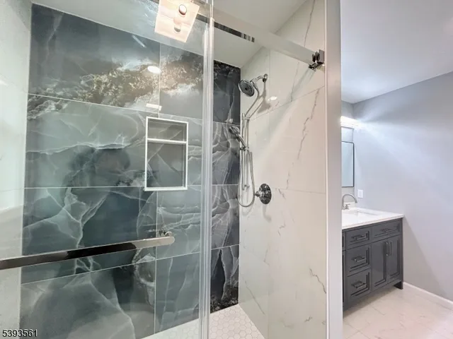 a bathroom with a shower and a sink