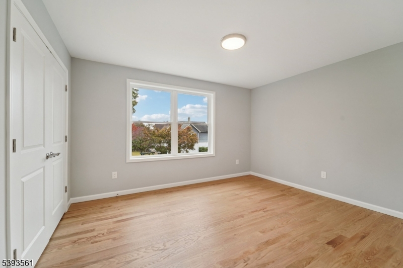 120 Addison Street Boonton, NJ 07005 - Photo 26 of 44 a view of an empty room with wooden floor and a window