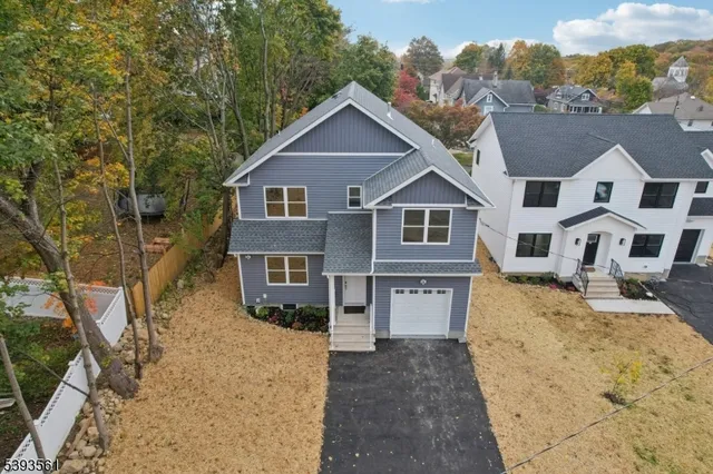 a view of house with yard