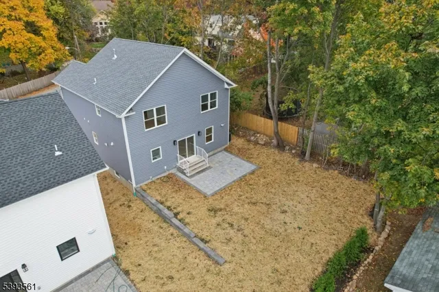 a aerial view of a house with a yard