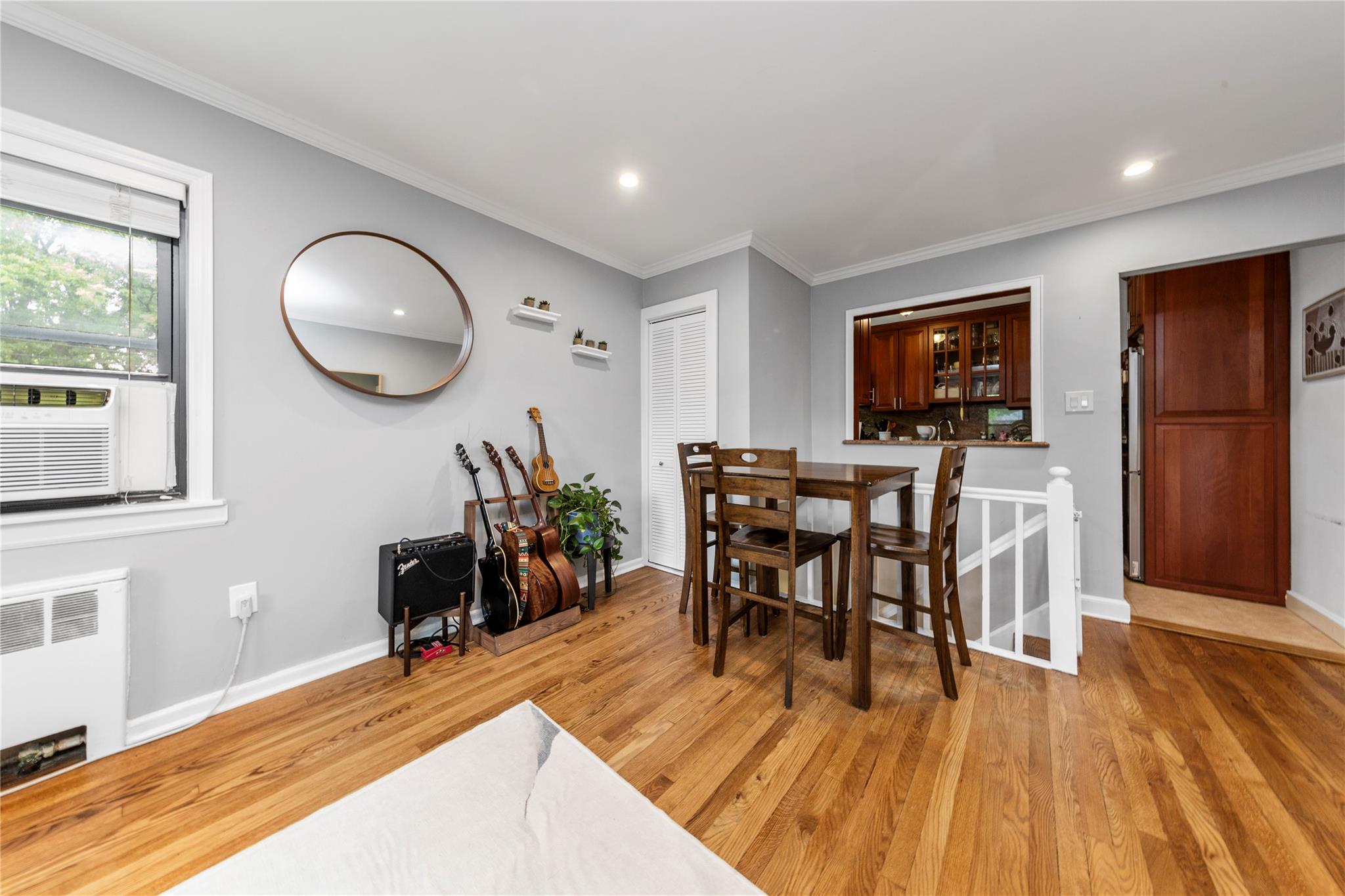 218-02 73rd Avenue, Unit UPPR Queens, NY 11364 - Photo 11 of 19 a view of a dining room with furniture and chandelier