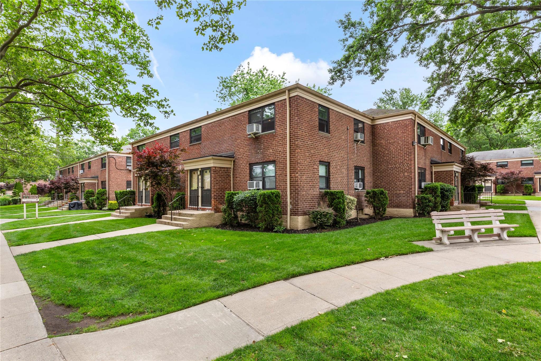 218-02 73rd Avenue, Unit UPPR Queens, NY 11364 - Photo 18 of 19 a front view of a house with a garden