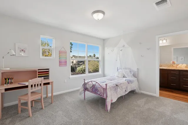 a bedroom with a bed and a furniture