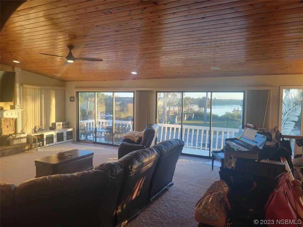 1012 South Riverside Drive Edgewater, FL 32132 - Photo 15 of 31 a living room with furniture and a large window