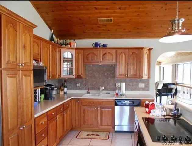 a view of a dining room with furniture and window