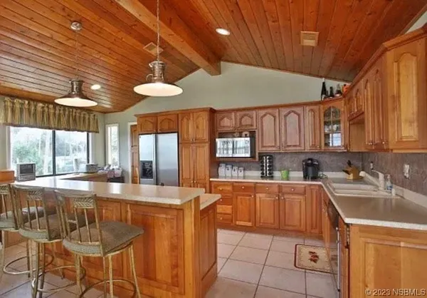 a bedroom with a bed couch and window