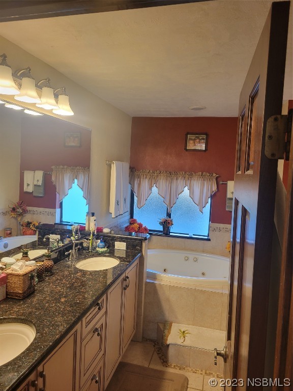 1012 South Riverside Drive Edgewater, FL 32132 - Photo 22 of 31 a bathroom with mirror sink and vanity