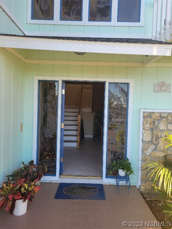 1012 South Riverside Drive Edgewater, FL 32132 - Photo 27 of 31 a view of a building with entryway and potted plants