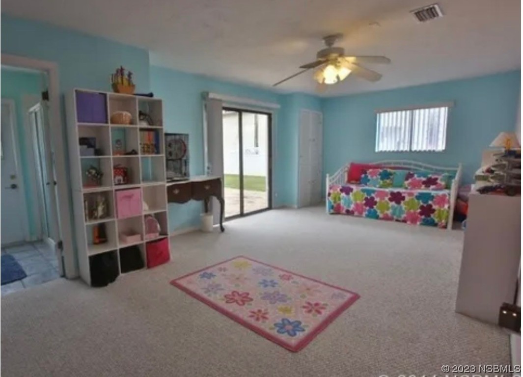 1012 South Riverside Drive Edgewater, FL 32132 - Photo 28 of 31 a living room with furniture and a window