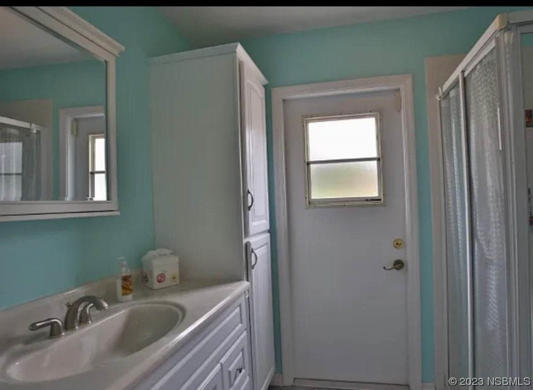 1012 South Riverside Drive Edgewater, FL 32132 - Photo 29 of 31 a bathroom with a sink and a mirror