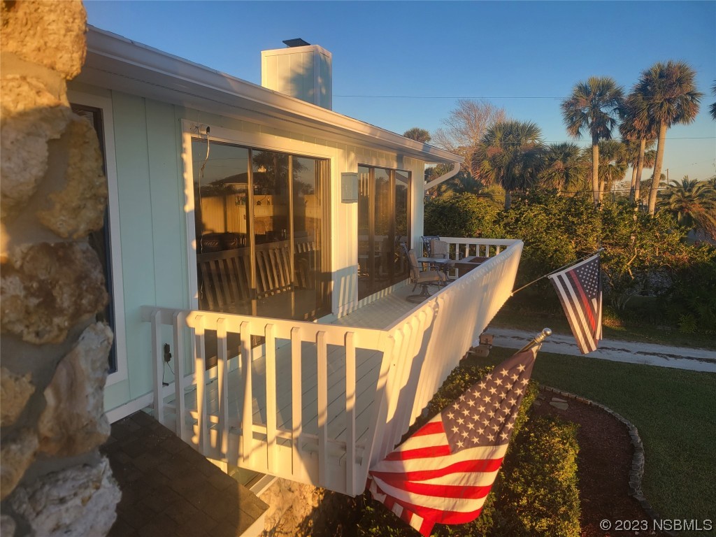 1012 South Riverside Drive Edgewater, FL 32132 - Photo 6 of 31 a view of an chairs and tables in the balcony
