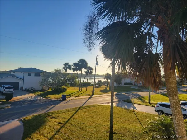 a view of swimming pool with sitting area