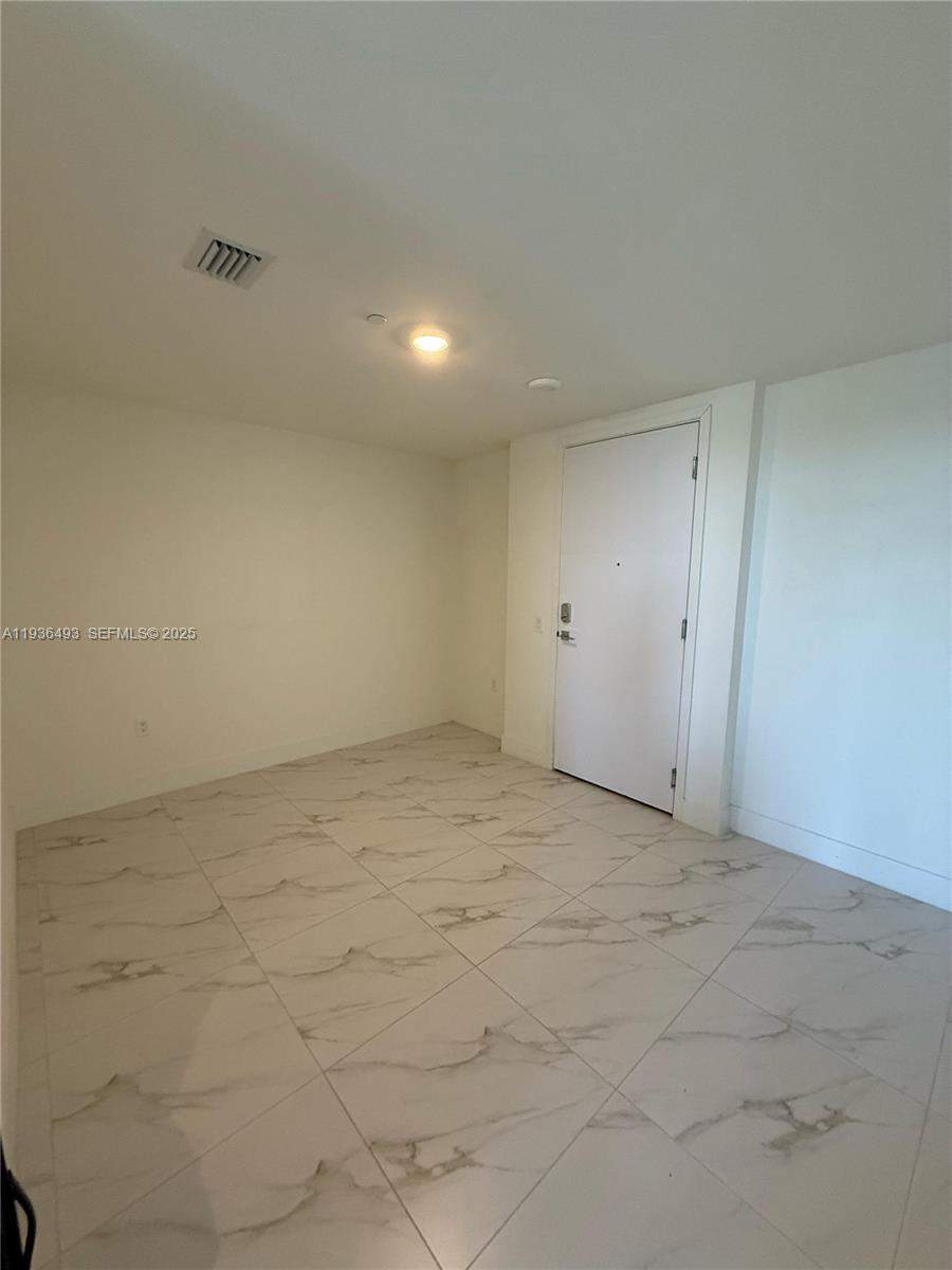2000 Metropica Way, Unit 901 Sunrise, FL 33323 - Photo 11 of 19 a view of an empty room