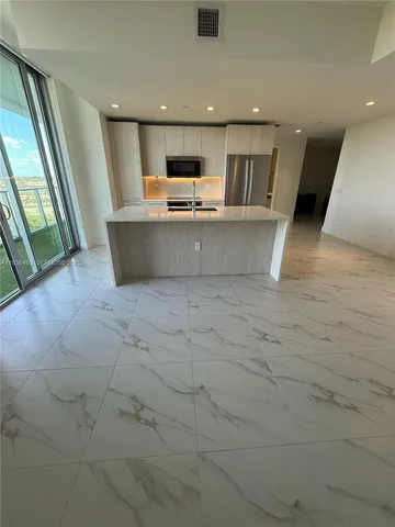 a view of a kitchen with a sink