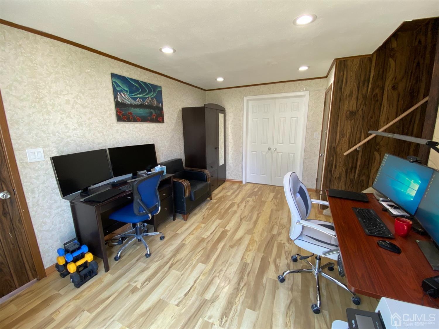 6 Moryan Road Edison, NJ 08817 - Photo 23 of 29 a view of a workspace with furniture and gym equipment