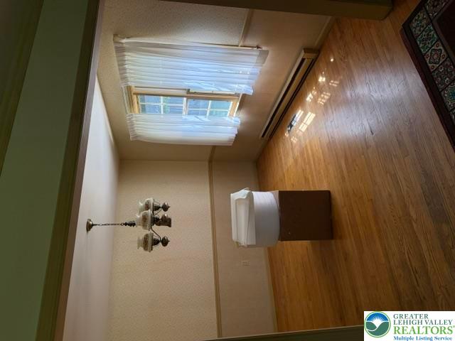 2045 Church Road Bethlehem, PA 18015 - Photo 17 of 42 A classic chandelier illuminates the polished hardwood flooring in this versatile room.