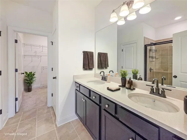 a bedroom with a large bed and a dresser