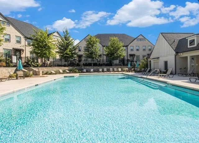 a front view of a house with swimming pool