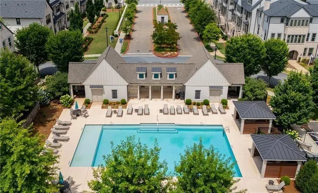 a view of a water pond with green yard