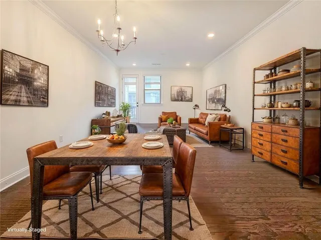 a bedroom with a large bed and a flat screen tv