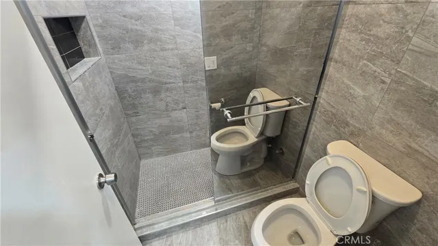 a bathroom with a toilet and a sink