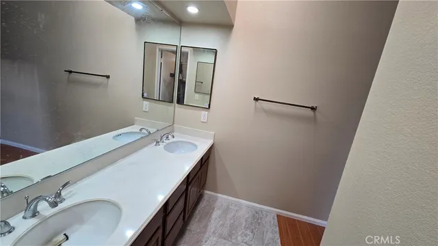 a bathroom with a sink and mirror