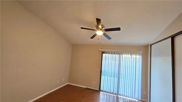 a view of room with window and ceiling fan