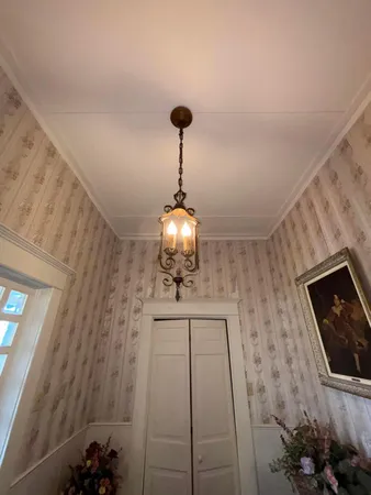 a front view of a house with a chandelier