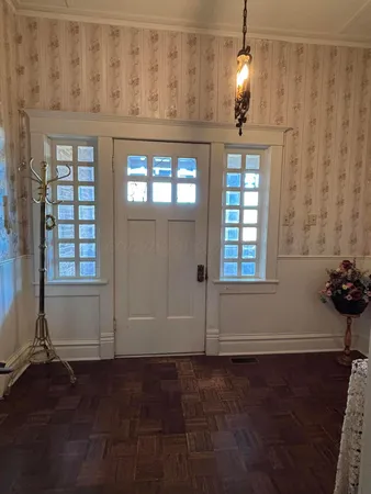 a bedroom with furniture and a window