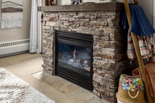 a living room with a couch and a fireplace