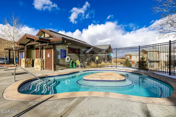 a view of a swimming pool with a patio