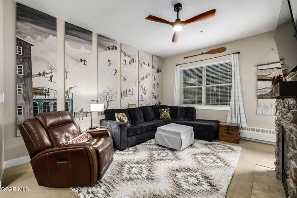 a living room with furniture window and wooden floor