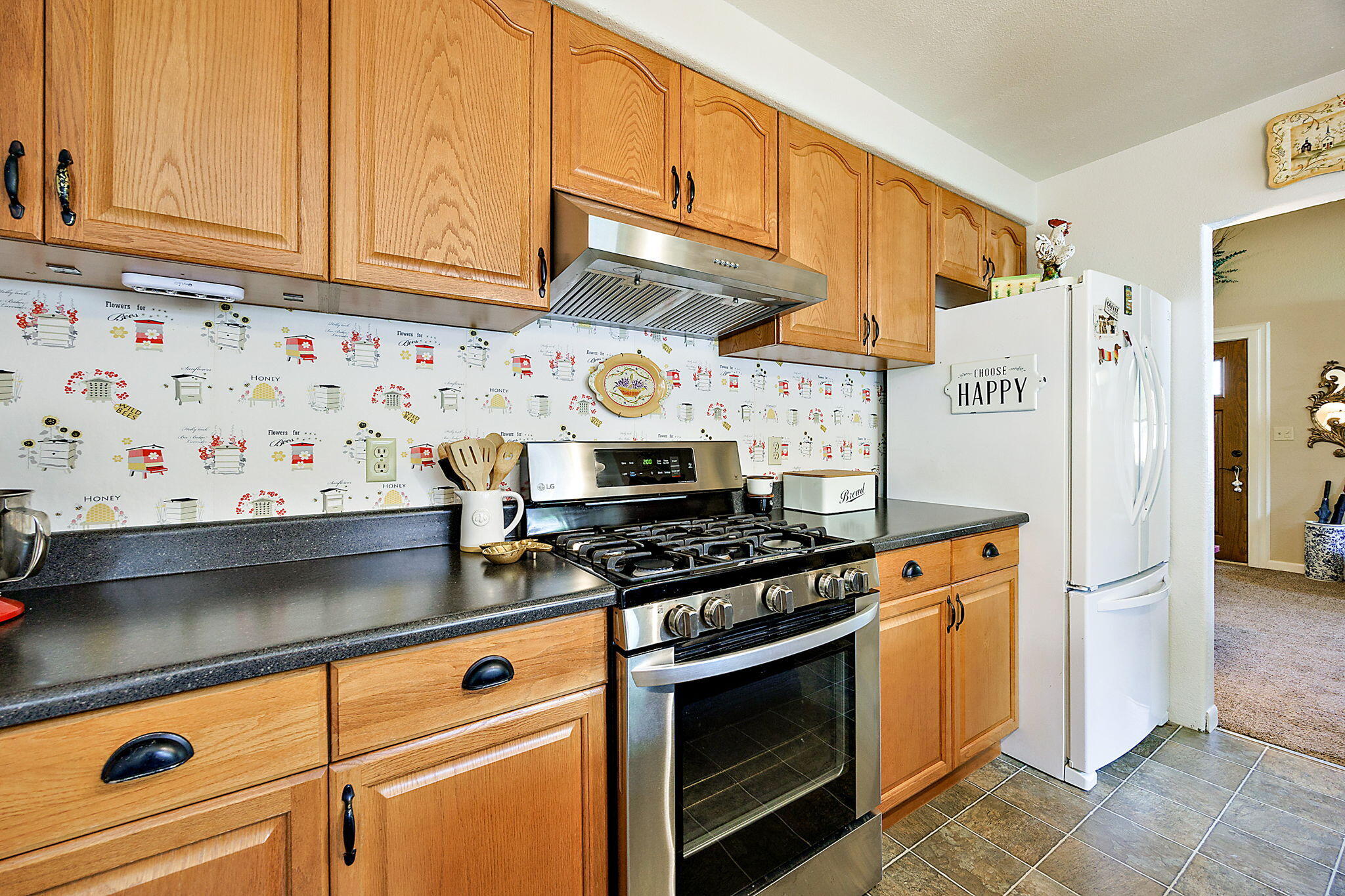 3744 Colver Road Phoenix, OR 97535 - Photo 36 of 58 a kitchen with stainless steel appliances granite countertop a stove and a refrigerator
