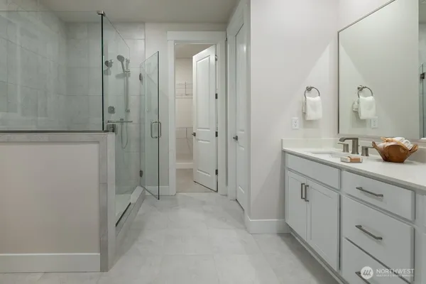 a large kitchen with a table and chairs