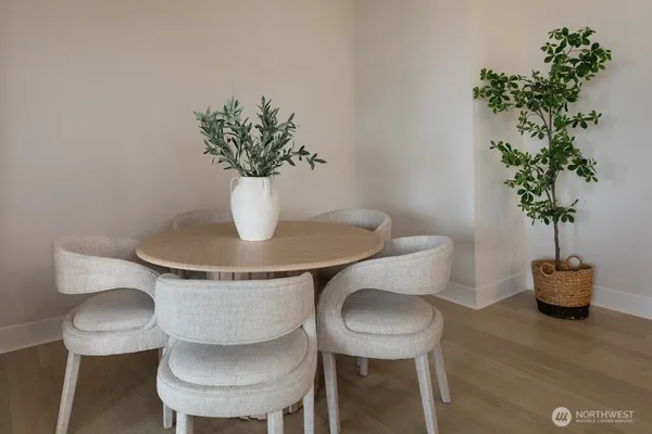 a bedroom with a bed and next to a window