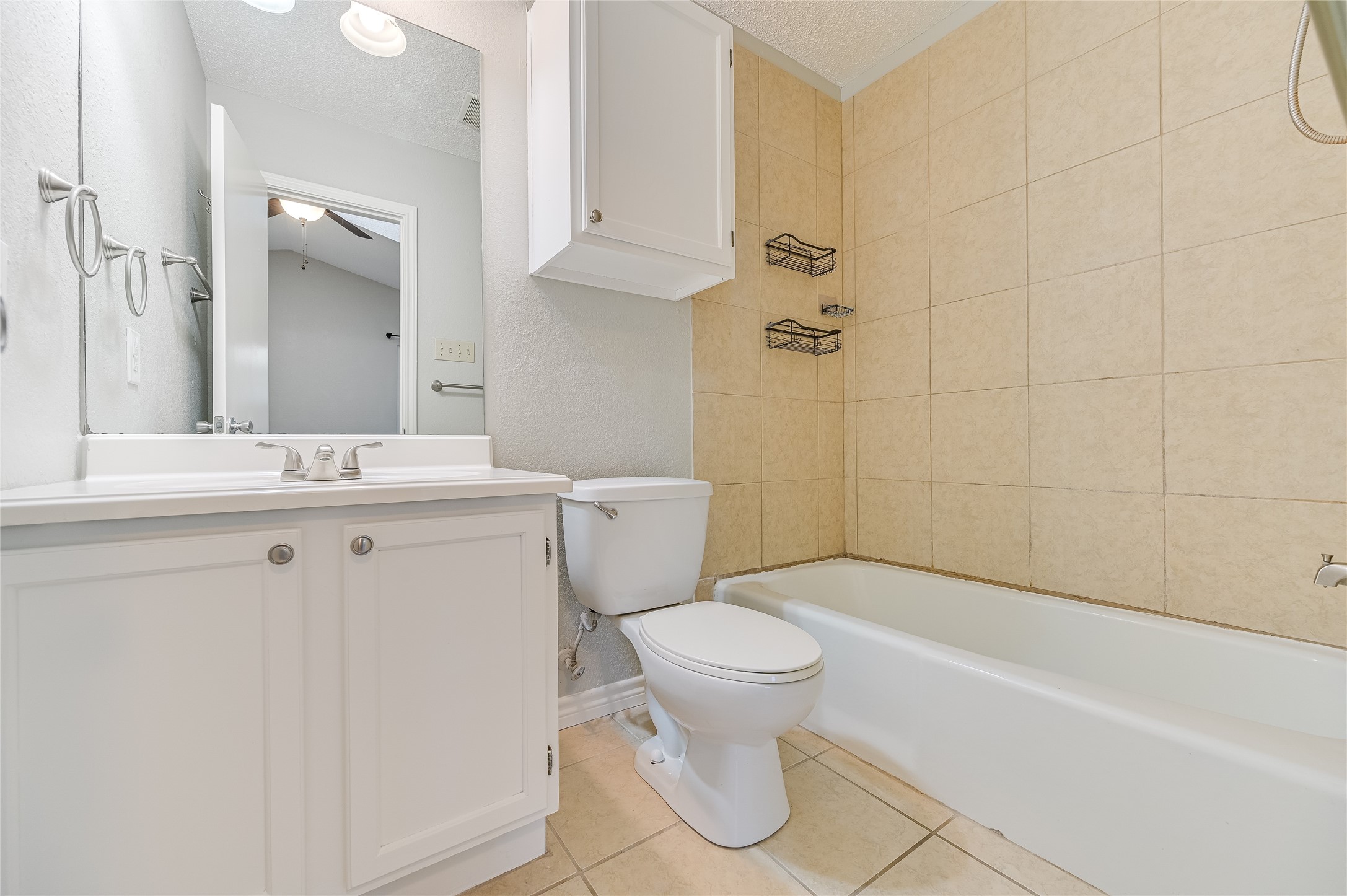 526 Cutty Trail, Unit B Lakeway, TX 78734 - Photo 8 of 10 Bathroom featuring a white vanity with integrated sink, chrome faucet, and a large wall-mounted mirror