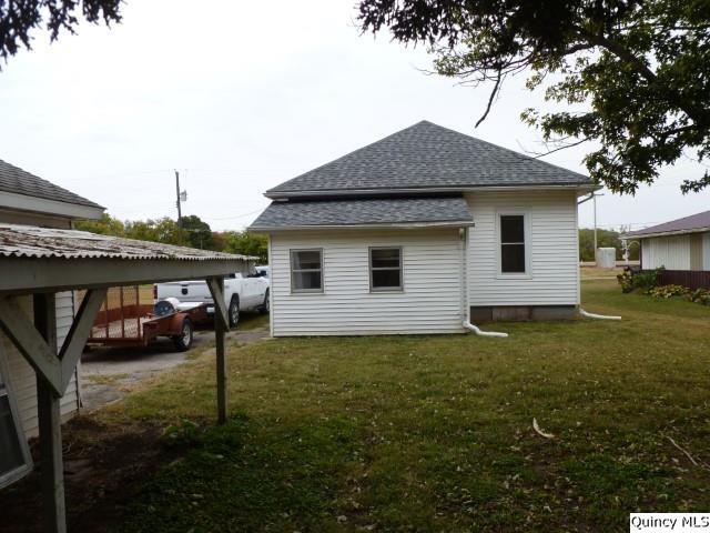 831 East Atchison Street Lomax, IL 61454 - Photo 21 of 24 a house view with a garden space