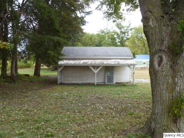 831 East Atchison Street Lomax, IL 61454 - Photo 22 of 24 a view of a tiny house with a yard