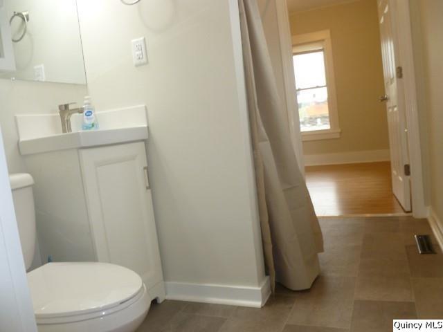 831 East Atchison Street Lomax, IL 61454 - Photo 8 of 24 a bathroom with a sink and a mirror