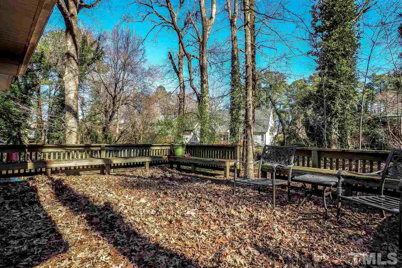 208 Winterlochen Road Raleigh, NC 27603 - Photo 22 of 25 a view of house with backyard and sitting area