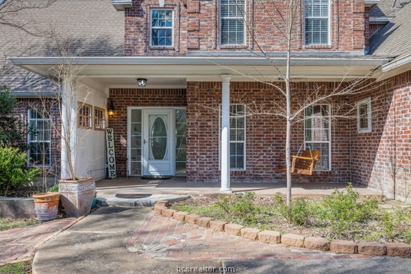 12 Raven's Nest Bryan, TX 77808 - Photo 4 of 46 a front view of a house with garden