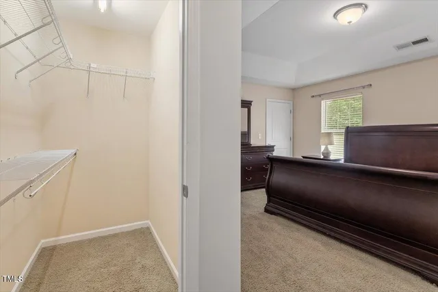 a bedroom with a bed and a cabinets