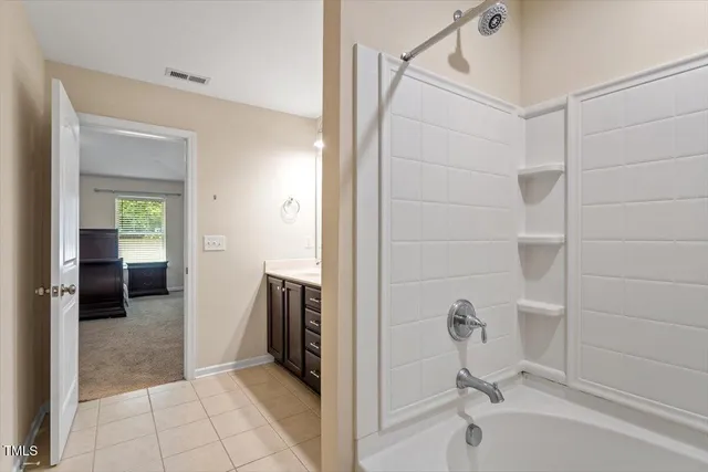 a view of a hallway with washer and dryer