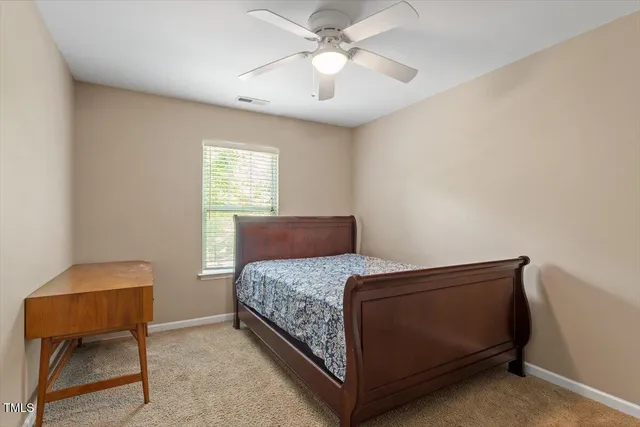 a bedroom with a bed and cabinets
