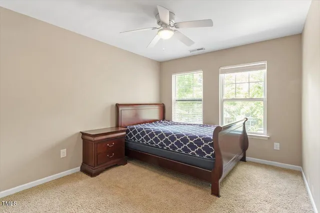 a bedroom with a bed and a table in it