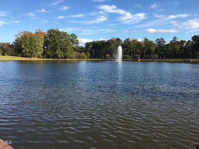 a view of a lake with a yard