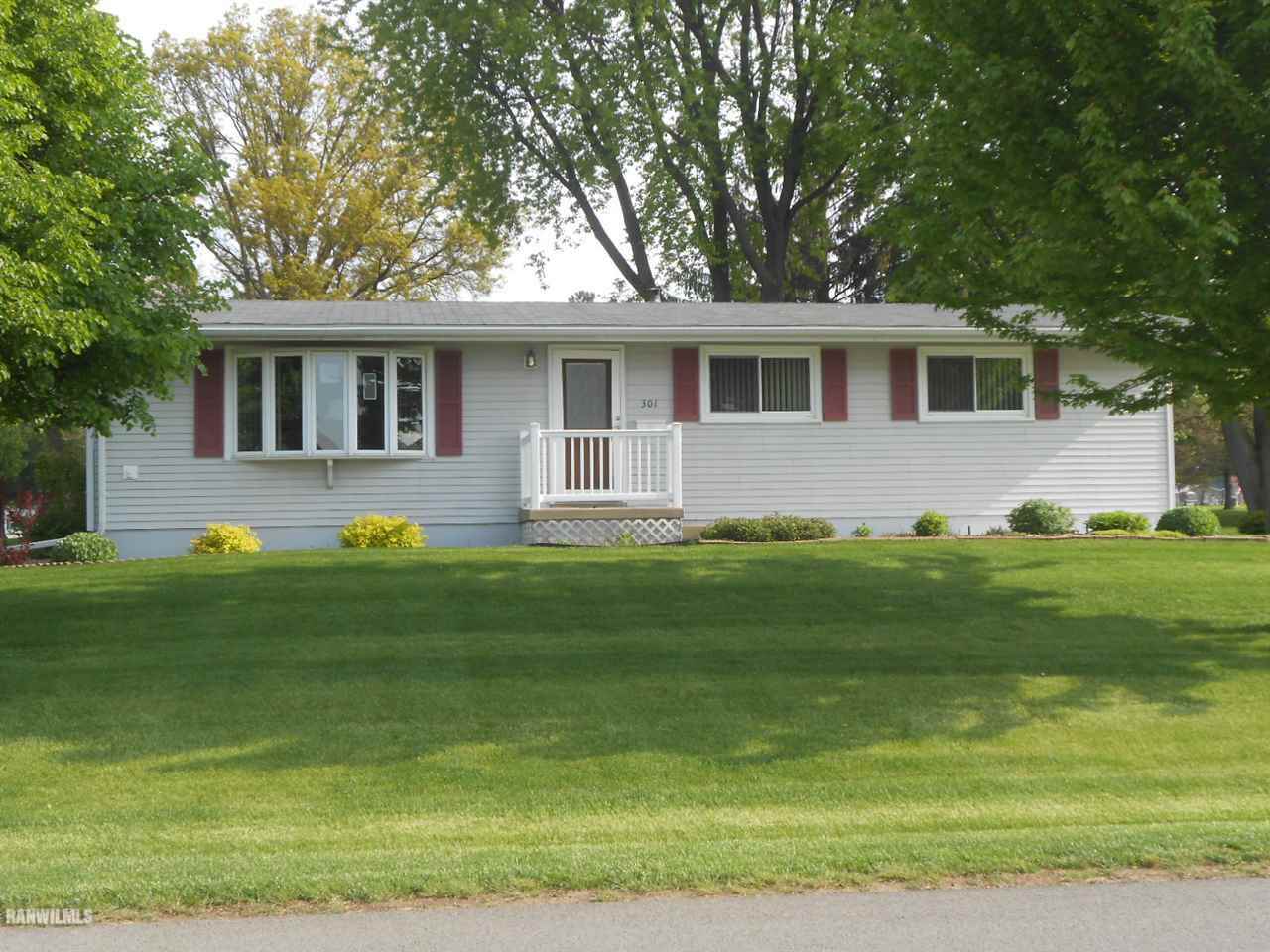 301 East Town Line Road Lena, IL 61048 - Photo 1 of 23 a front view of a house with a garden
