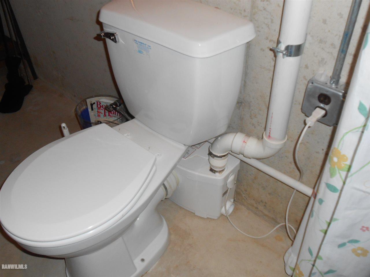 301 East Town Line Road Lena, IL 61048 - Photo 23 of 23 a bathroom with a sink and toilet