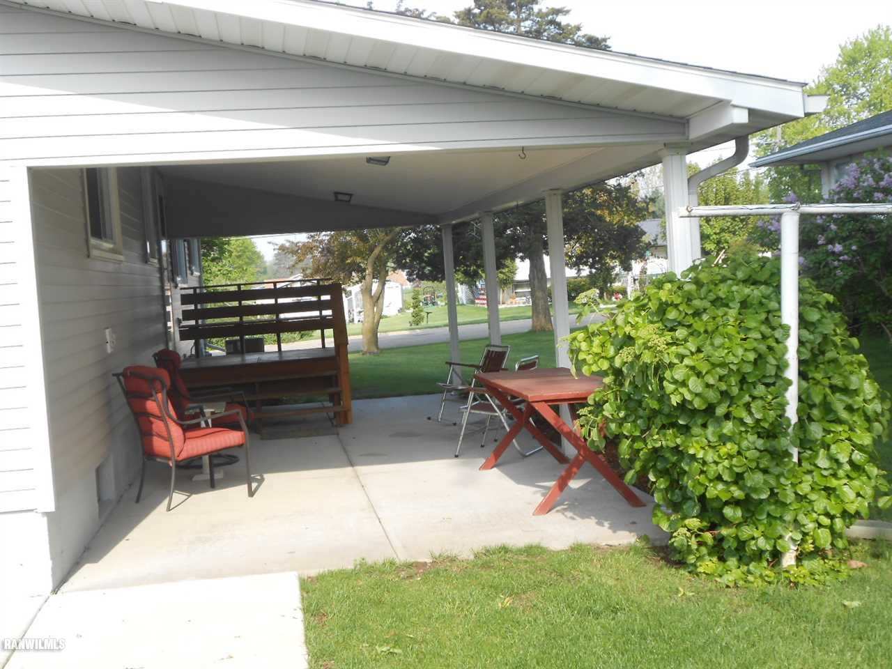 301 East Town Line Road Lena, IL 61048 - Photo 3 of 23 a backyard of a house with outdoor seating