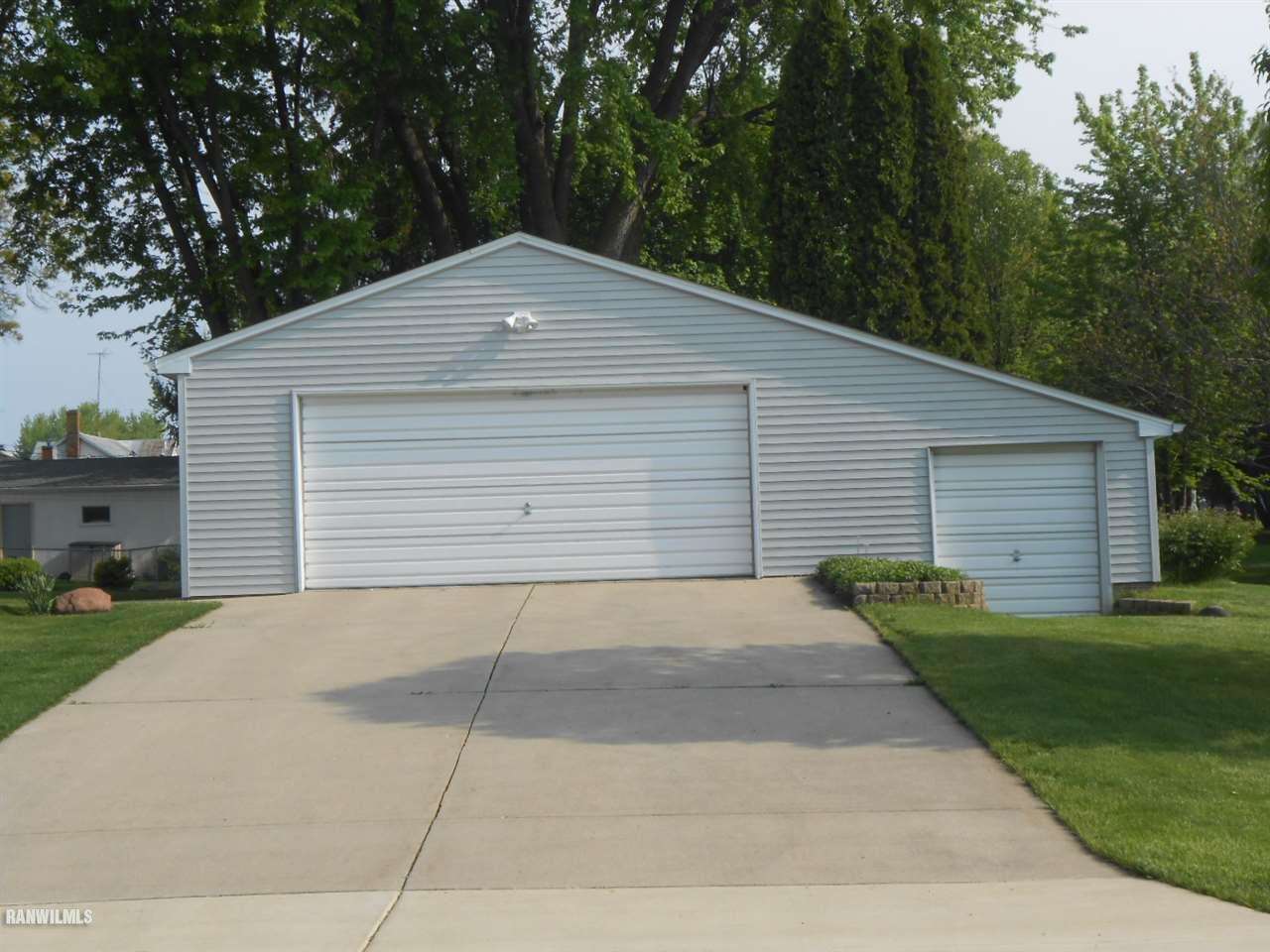 301 East Town Line Road Lena, IL 61048 - Photo 5 of 23 a front view of a house with a yard and garage